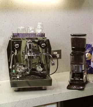 Manual Espresso machine placed on kitchen shelf
