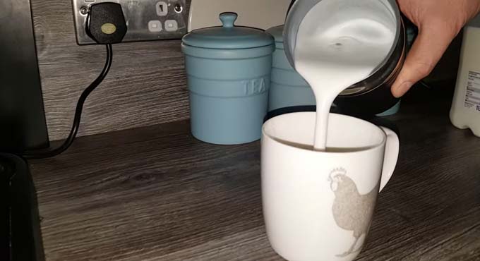 adding milk into cup